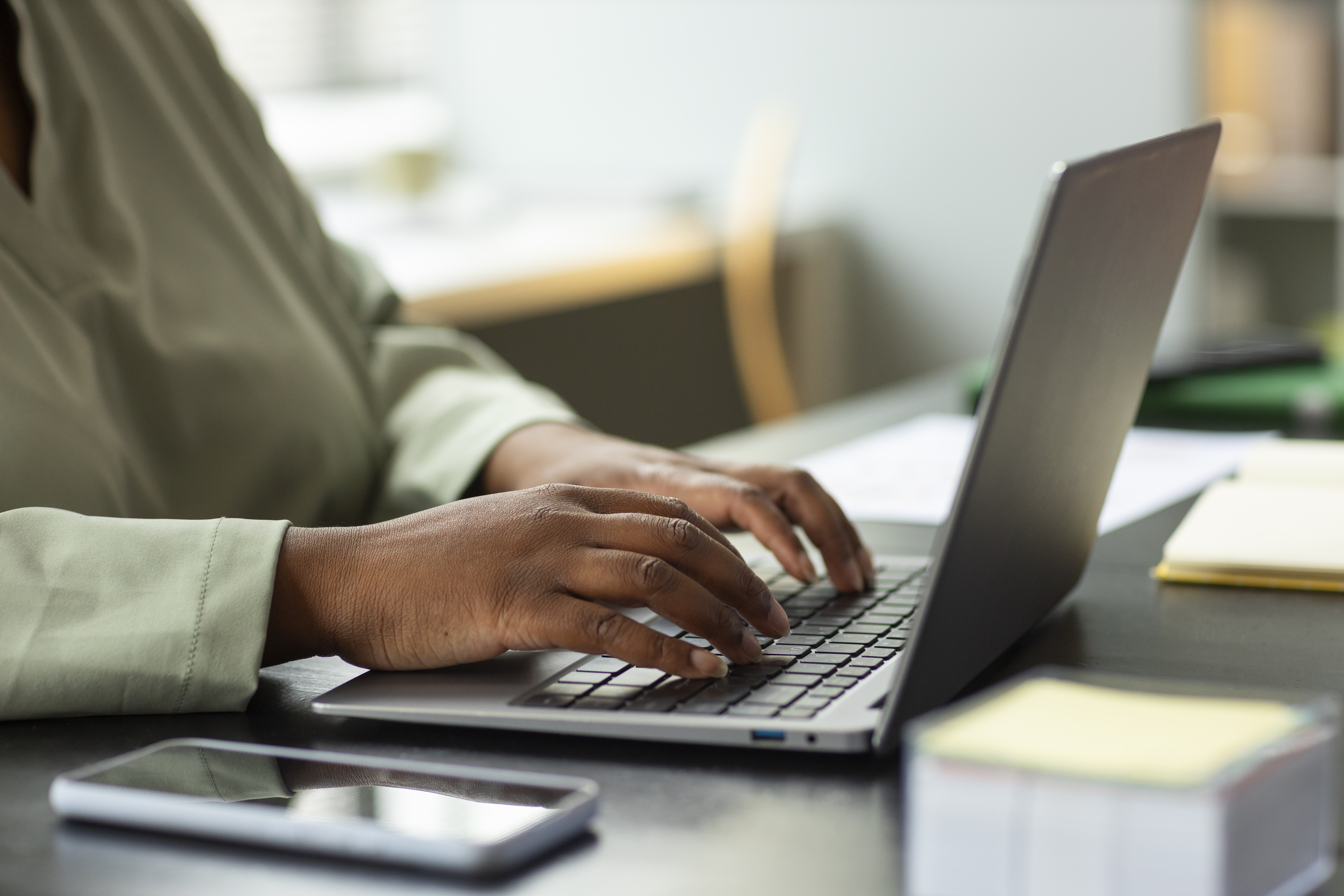 Computer user facing right.